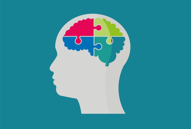 Illustration von einem Kopf mit einem bunten Puzzle als Gehirn